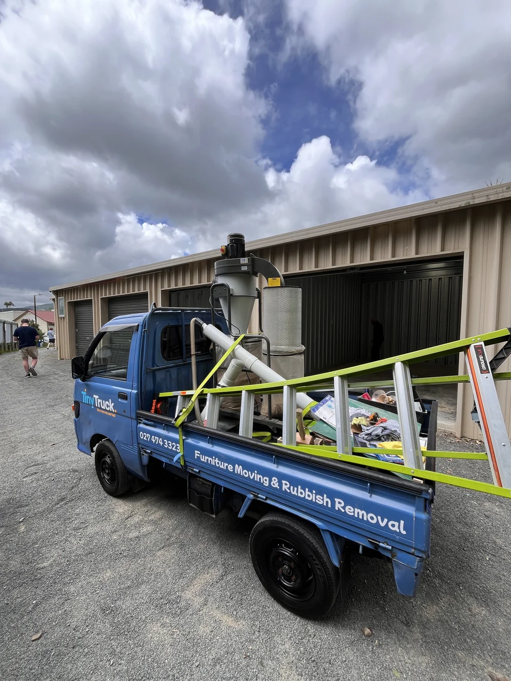 Tiny Truck loaded with a dust extractor, ladder and workshop gear for a storage unit move