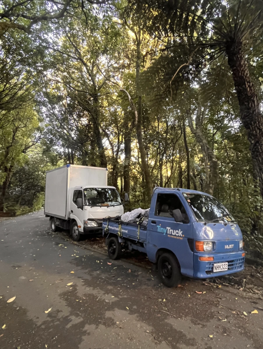 Tiny Truck's original blue ute with a load parked in front of the new white box truck