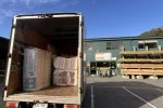 Tiny Truck's new box truck with its back open showing wrapped goods ready to unload
