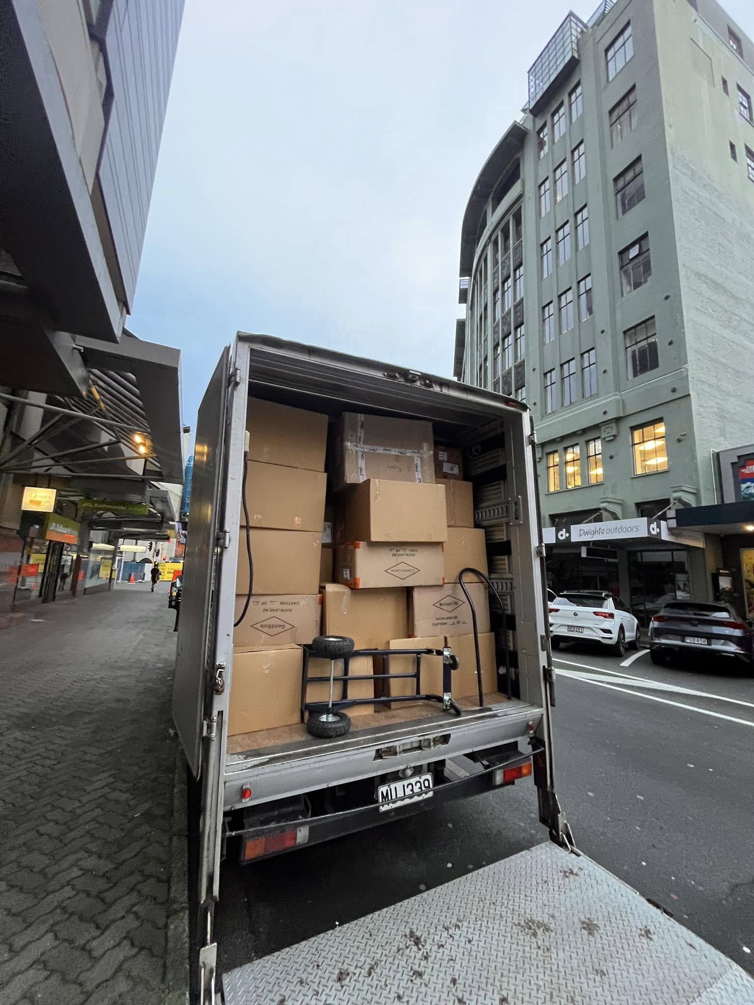 Tiny Truck box truck packed with cartons and a hand trolley for a Wellington city delivery